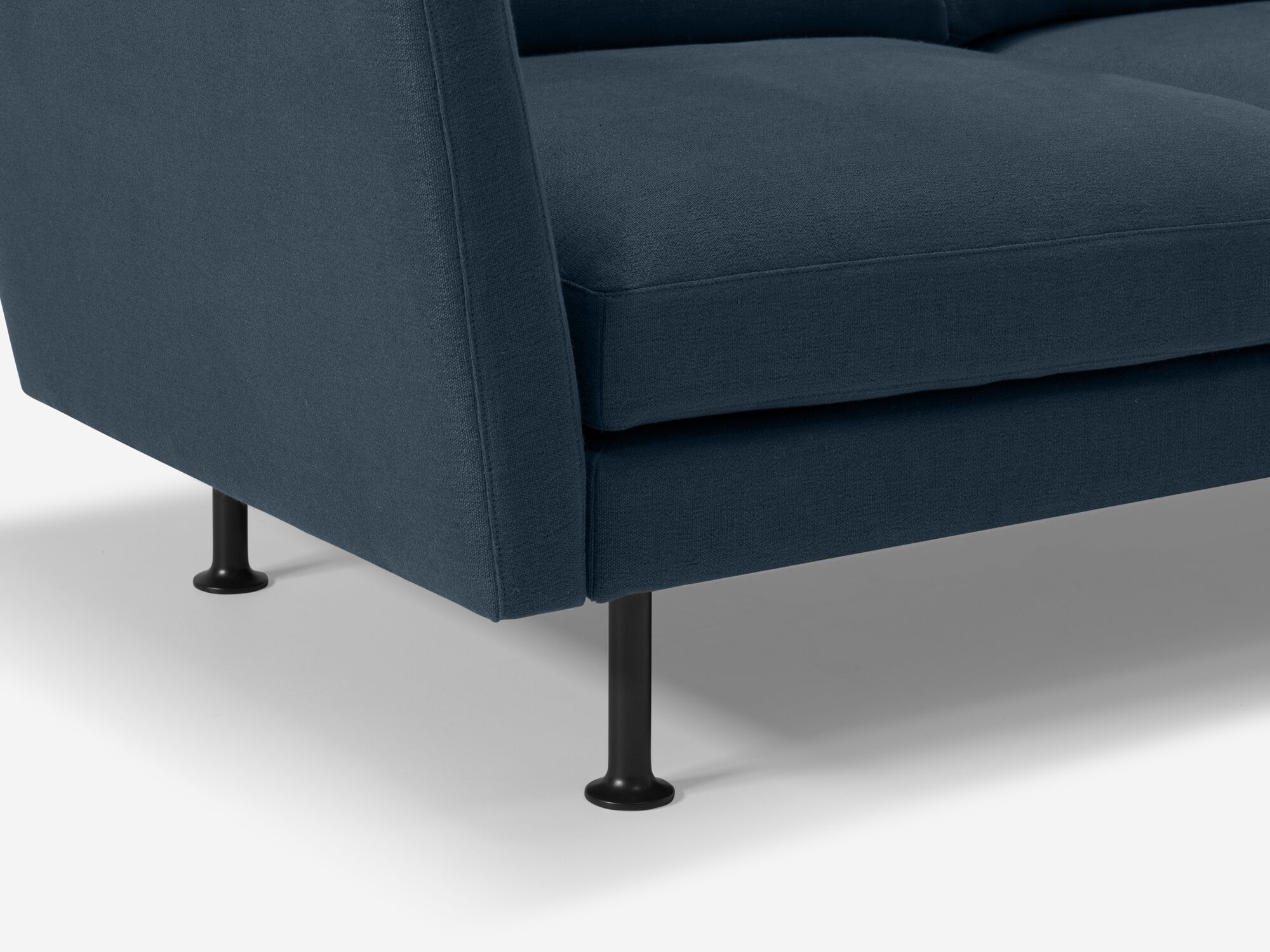 Leg detail view of blue modern loveseat